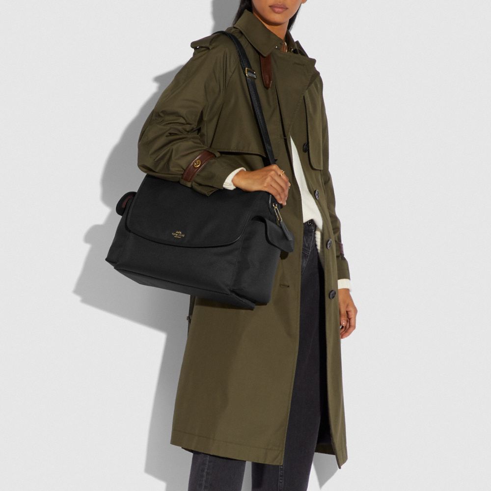 COACH®: Baby Messenger Bag In Signature Canvas