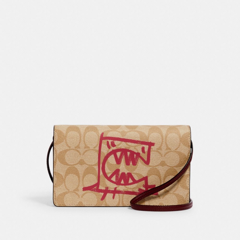 Anna foldover crossbody clutch in signature 2024 canvas with rexy by guang yu