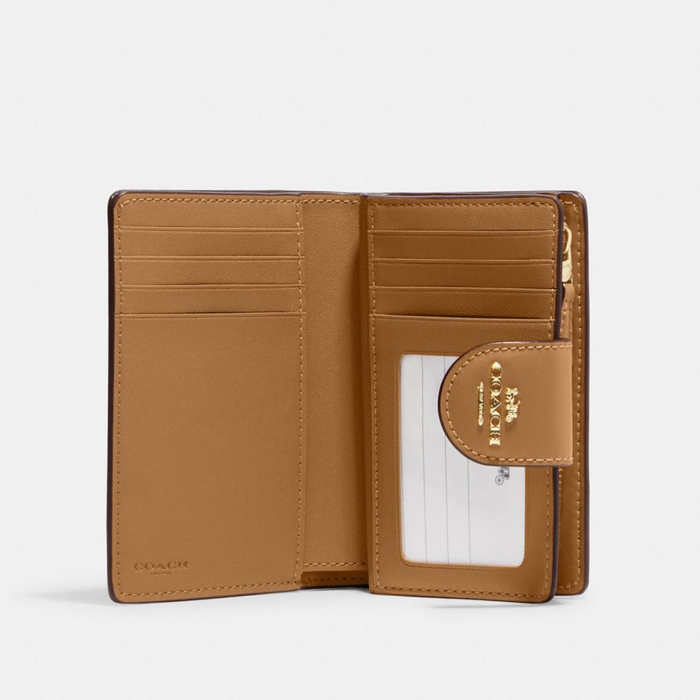 Medium Corner Zip Wallet In Signature Canvas