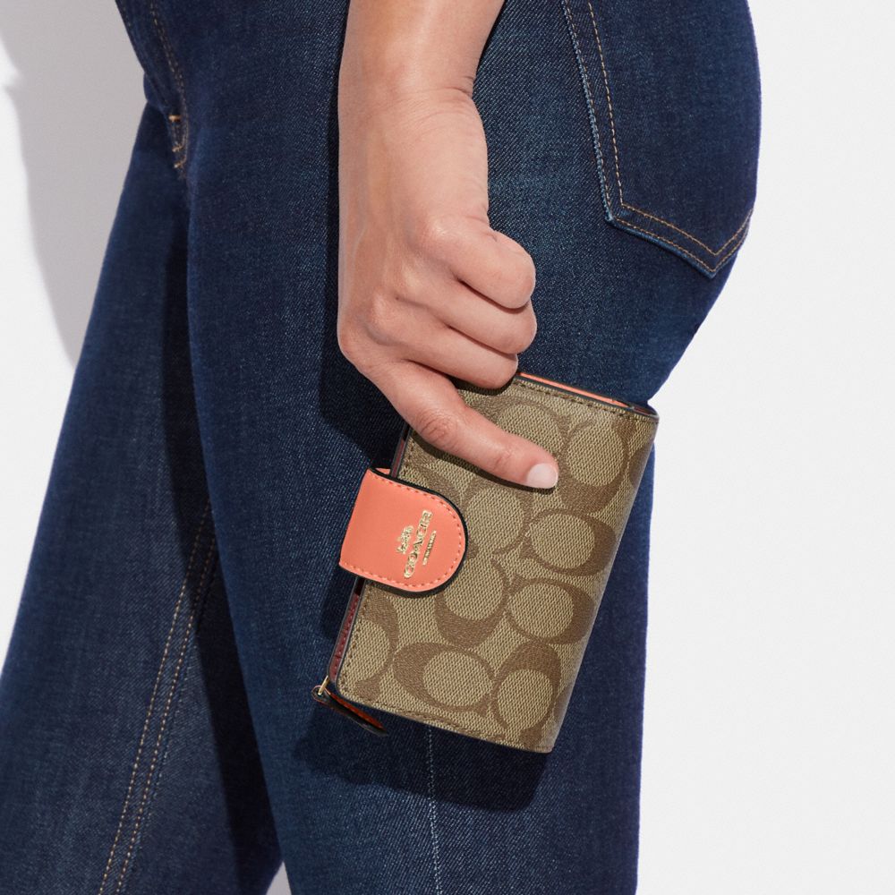 COACH OUTLET® | Medium Corner Zip Wallet In Signature Canvas