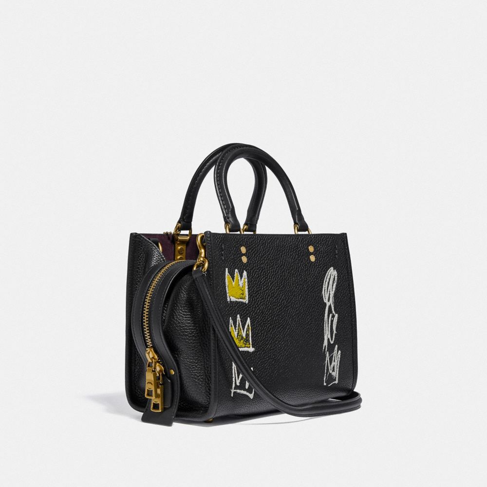 COACH®,COACH X JEAN-MICHEL BASQUIAT ROGUE BAG 25,Leather,Medium,Brass/Black,Angle View