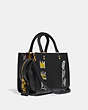 COACH®,COACH X JEAN-MICHEL BASQUIAT ROGUE BAG 25,Leather,Medium,Brass/Black,Angle View