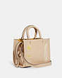 COACH®,COACH X JEAN-MICHEL BASQUIAT ROGUE BAG 25,Leather,Medium,Brass/Ivory,Angle View