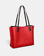 COACH®,WILLOW TOTE BAG IN COLORBLOCK,Pebble Leather,Large,Brass/Sport Red Multi,Angle View