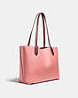 COACH®,WILLOW TOTE BAG IN COLORBLOCK WITH SIGNATURE CANVAS INTERIOR,Pebble Leather,Large,Brass/Candy Pink Multi,Angle View