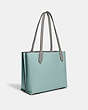 COACH®,WILLOW TOTE BAG IN COLORBLOCK WITH SIGNATURE CANVAS INTERIOR,Pebble Leather,Large,Pewter/Aqua Multi,Angle View