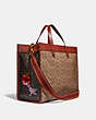 COACH®,FIELD TOTE BAG 40 IN SIGNATURE CANVAS WITH SOUVENIR PATCHES,pvc,X-Large,Brass/Tan Truffle Rust,Angle View