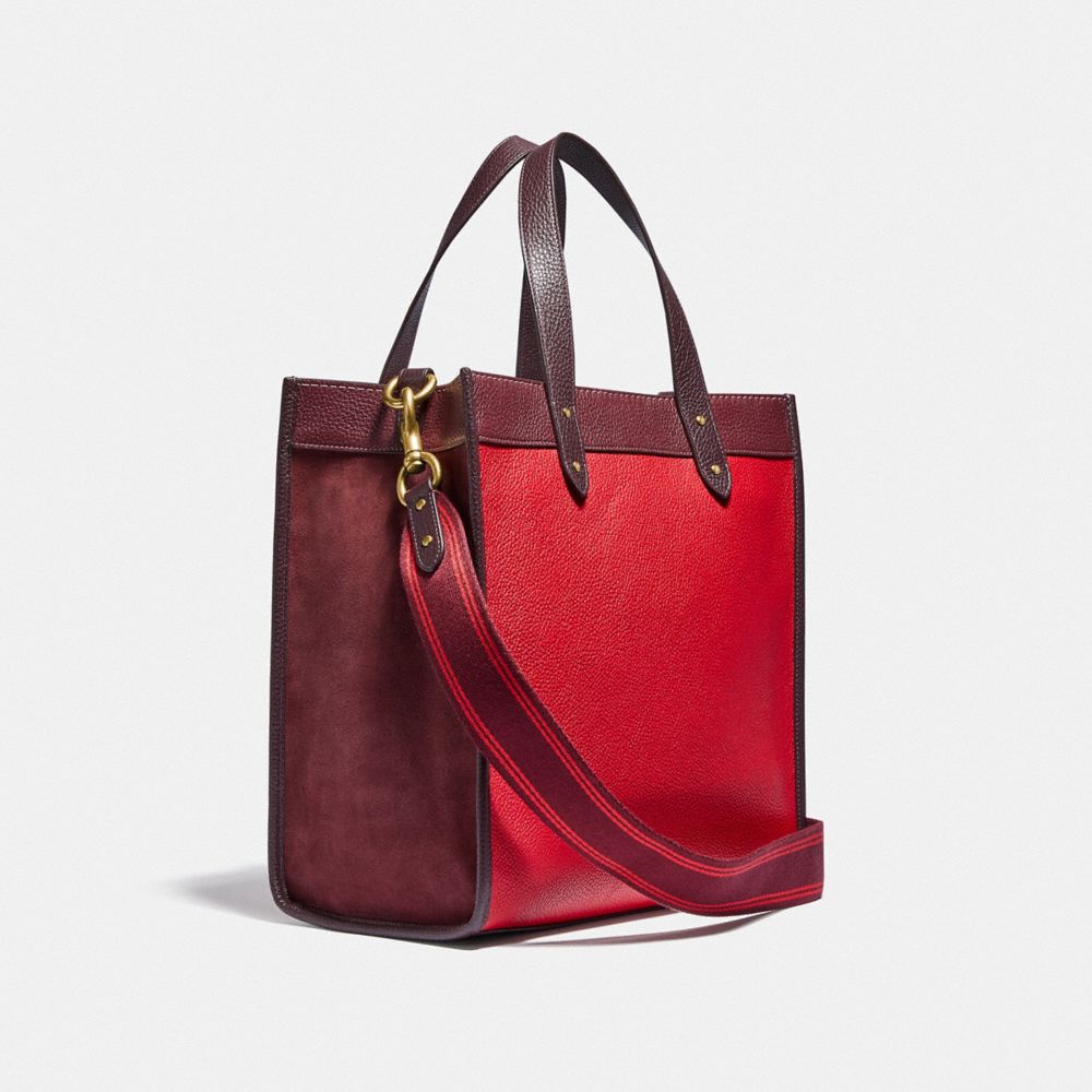 COACH®,FIELD TOTE IN COLORBLOCK WITH COACH BADGE,Pebble Leather,X-Large,Brass/Electric Red Multi,Angle View