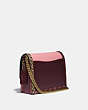 COACH®,COACH X JENNIFER LOPEZ HUTTON SHOULDER BAG IN COLORBLOCK WITH SNAKESKIN DETAIL,Smooth Leather/Exotic,Small,Brass/Peony Oxblood Multi,Angle View