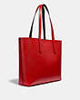 COACH®,DISNEY MICKEY MOUSE X KEITH HARING HIGHLINE TOTE,pusplitleather,X-Large,Brass/Electric Red,Angle View