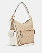 COACH®,PENNIE SHOULDER BAG IN SIGNATURE CANVAS,Leather,Large,Gold/Light Khaki Chalk,Angle View