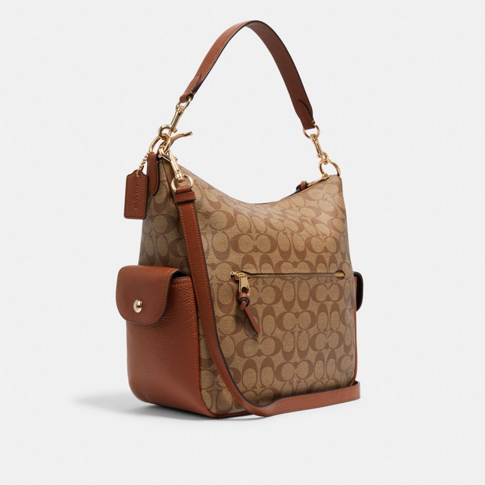 COACH®,Pennie Shoulder Bag In Signature Canvas,,Angle View