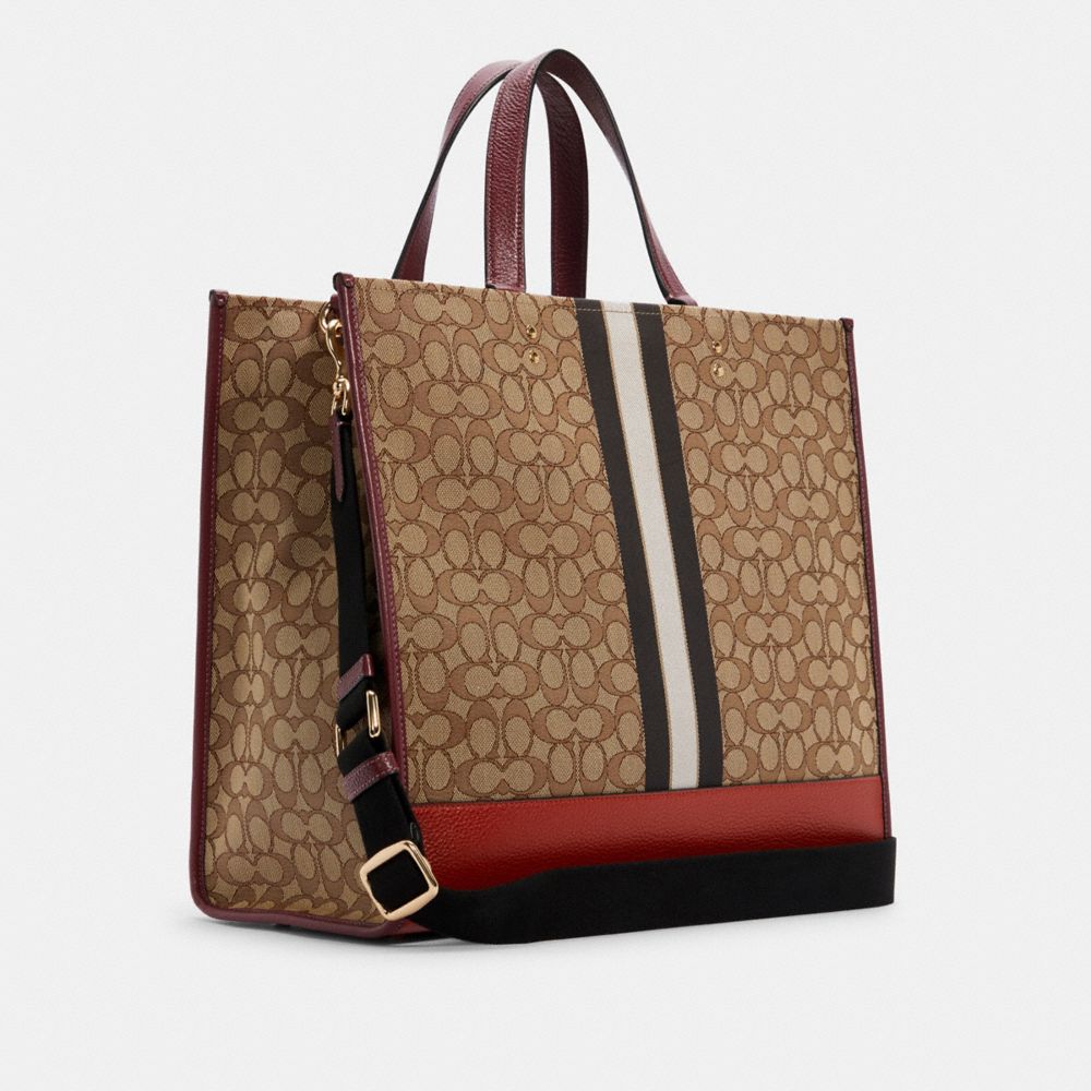 COACH®,Dempsey Tote Bag 40 In Signature Jacquard With Stripe And Coach Patch,,Angle View