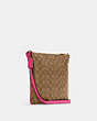 COACH®,ROWAN FILE BAG IN SIGNATURE CANVAS,pvc,Medium,Everyday,Gold/Khaki/Bold Pink,Angle View
