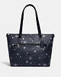 COACH®,GALLERY TOTE IN SIGNATURE CANVAS WITH SNOWFLAKE PRINT,Medium,Silver/Midnight Multi,Front View