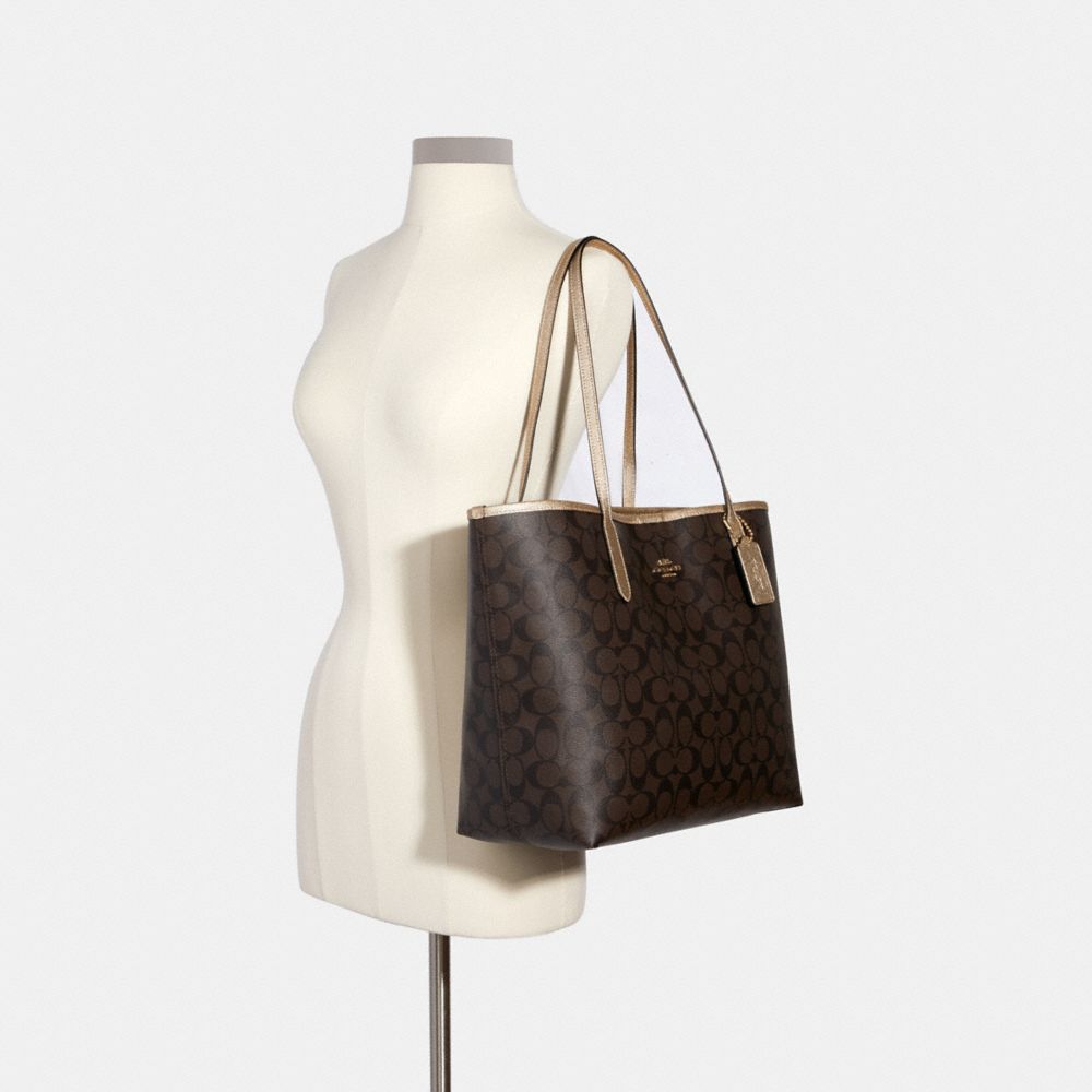 Coach city zip online tote in signature canvas