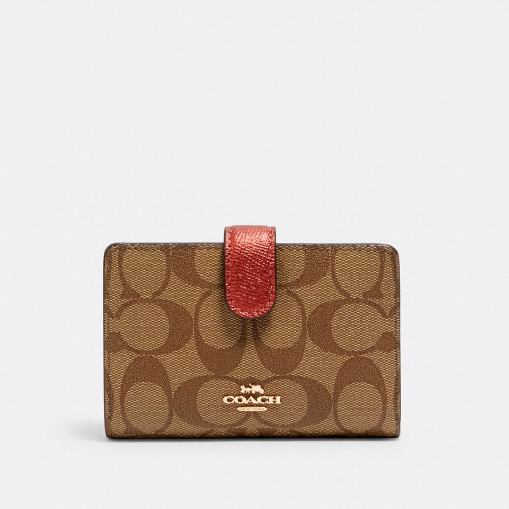 Medium corner zip best sale wallet in signature leather