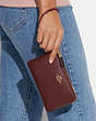 COACH®,DOUBLE CORNER ZIP WRISTLET,Leather,Small,Gold/Wine Multi,Detail View