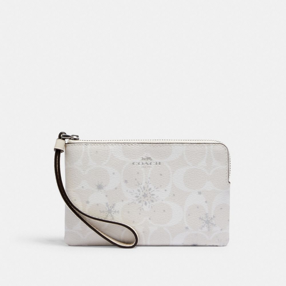 Wristlet à zip en coin en toile Signature avec imprimé Flocon de neige