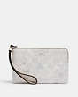 COACH®,CORNER ZIP WRISTLET IN SIGNATURE CANVAS WITH SNOWFLAKE PRINT,Silver/Chalk Multi,Front View