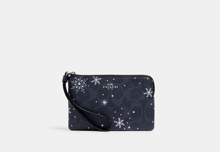 COACH®,CORNER ZIP WRISTLET IN SIGNATURE CANVAS WITH SNOWFLAKE PRINT,Silver/Midnight Multi,Front View