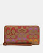COACH®,LARGE PHONE WALLET IN RAINBOW SIGNATURE CANVAS,Gold/Khaki Multi,Front View