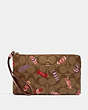 COACH®,LARGE CORNER ZIP WRISTLET IN SIGNATURE CANVAS WITH CANDY PRINT,Gold/Khaki Multi,Front View