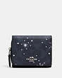 COACH®,SMALL TRIFOLD WALLET IN SIGNATURE CANVAS WITH SNOWFLAKE PRINT,Silver/Midnight Multi,Front View