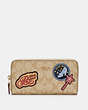 COACH®,DISNEY X COACH ACCORDION ZIP WALLET IN SIGNATURE CANVAS WITH PATCHES,Gold/Light Khaki Multi,Front View