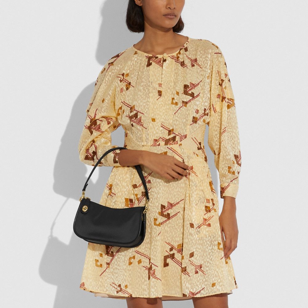 COACH®,Swinger Bag With Vintage Rose Print Interior,,Detail View