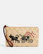 COACH®,LUNAR NEW YEAR LARGE CORNER ZIP WRISTLET IN SIGNATURE CANVAS WITH OX AND CARRIAGE,Gold/Light Khaki Multi,Front View