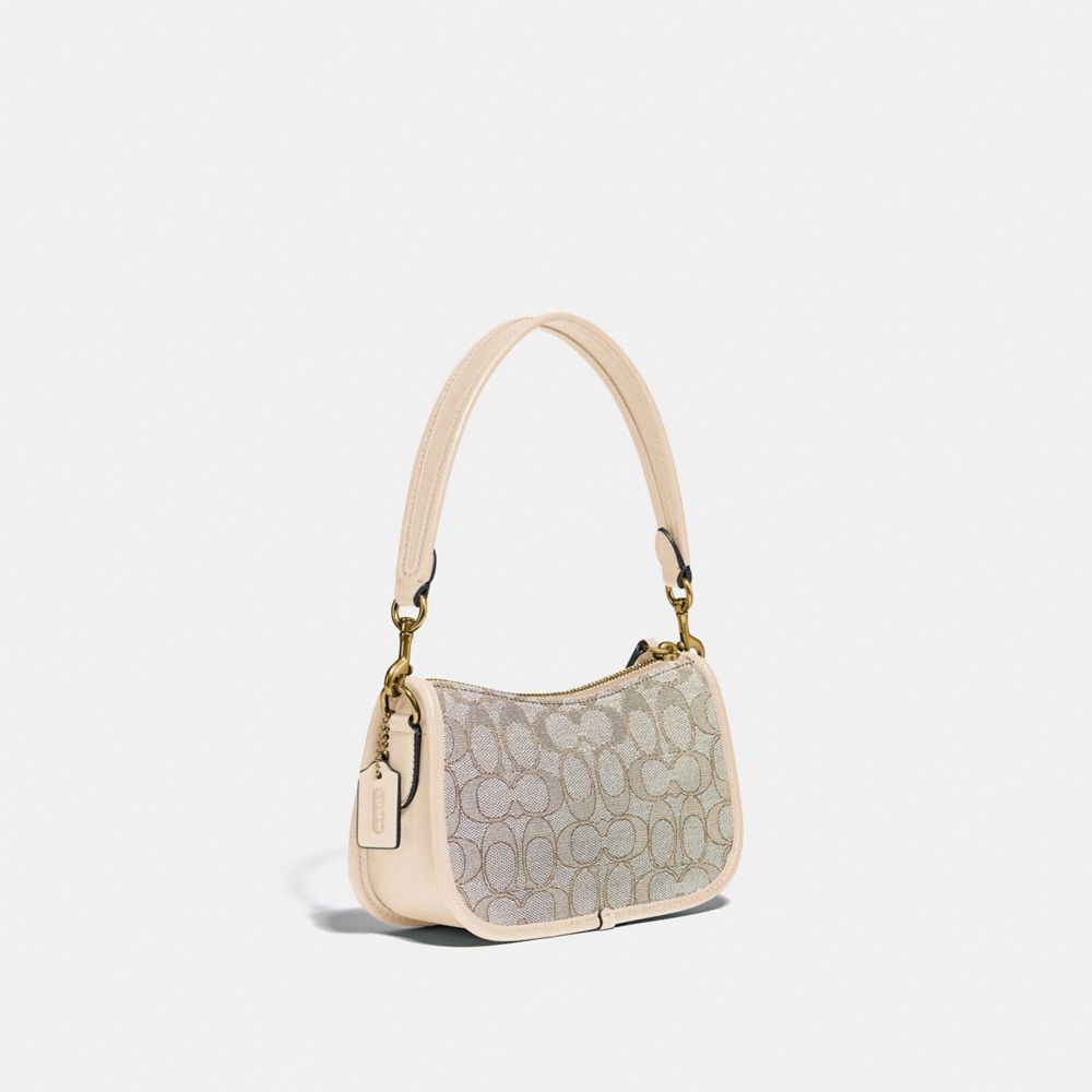 COACH®,Swinger Bag 20 In Signature Jacquard,,Angle View