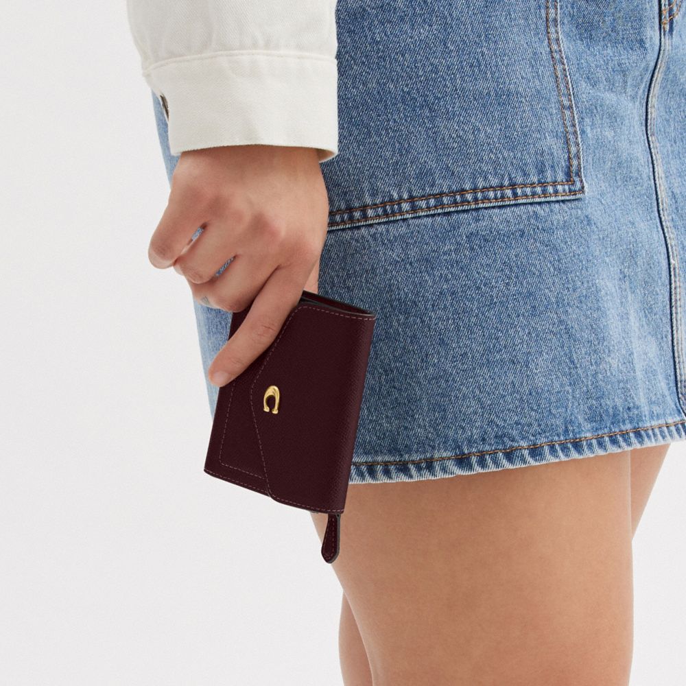 Shop Coach Wyn Small Wallet In Brass/merlot