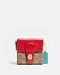 COACH®,LUNAR NEW YEAR SQUARE BAG 10 IN SIGNATURE CANVAS,Signature Coated Canvas/Smooth Leather,Mini,Brass/Tan Electric Red Multi,Front View