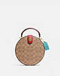 COACH®,LUNAR NEW YEAR CIRCLE BAG IN SIGNATURE CANVAS,Signature Coated Canvas/Smooth Leather,Medium,Brass/Tan Electric Red Multi,Front View