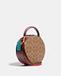 COACH®,LUNAR NEW YEAR CIRCLE BAG IN SIGNATURE CANVAS,Signature Coated Canvas/Smooth Leather,Medium,Brass/Tan Electric Red Multi,Angle View