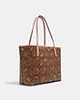 COACH®,CITY TOTE IN SIGNATURE CANVAS WITH CANDY PRINT,pvc,Large,Gold/Khaki Multi,Angle View