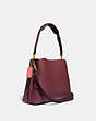 COACH®,WILLOW SHOULDER BAG IN COLORBLOCK,Pebble Leather,Medium,Brass/Black Cherry Multi,Angle View