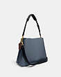 COACH®,WILLOW SHOULDER BAG IN COLORBLOCK,Pebble Leather,Medium,Brass/Denim,Angle View
