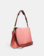 COACH®,WILLOW SHOULDER BAG IN COLORBLOCK,Refined Pebble Leather,Medium,Brass/Candy Pink Multi,Angle View