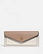 COACH®,WYN SOFT WALLET IN COLORBLOCK,Pebble Leather,Brass/Chalk Taupe Multi,Front View