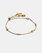 COACH®,CLASSIC CRYSTAL PEARL SLIDER BRACELET,Plated Brass,Gold,Front View