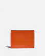 COACH®,SLIM BILLFOLD WALLET IN COLORBLOCK,Smooth Leather,Spice Orange/Dark Saddle,Front View