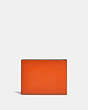 COACH®,SLIM BILLFOLD WALLET IN COLORBLOCK,Smooth Leather,Spice Orange/Dark Saddle,Back View