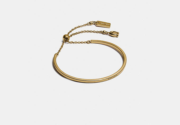 COACH®,SIGNATURE SLIDER BANGLE,Plated Brass,Gold,Front View