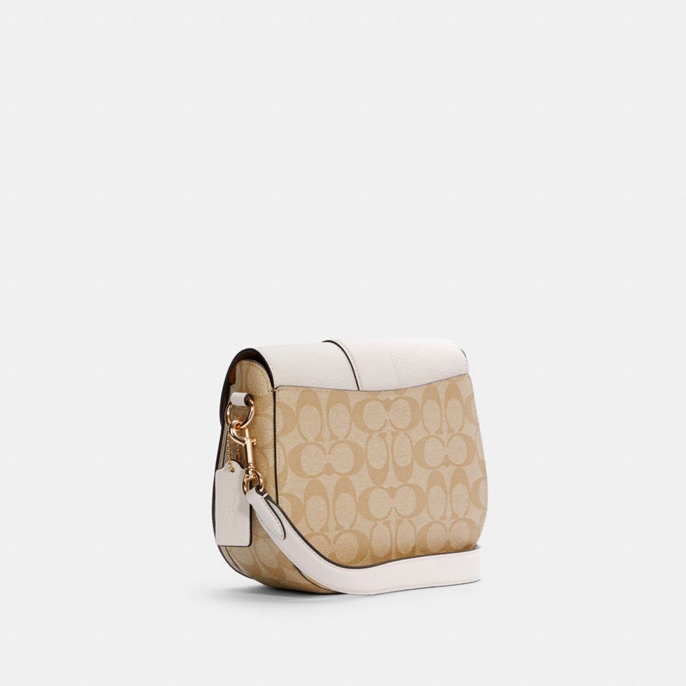 COACH®,GEORGIE SADDLE BAG IN SIGNATURE CANVAS,pvc,Medium,Gold/Light Khaki Chalk,Angle View