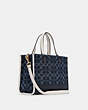 COACH®,DEMPSEY CARRYALL IN SIGNATURE JACQUARD WITH COACH PATCH,Jacquard,Medium,Gold/Denim Multi,Angle View