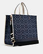 COACH®,DEMPSEY TOTE BAG 40 IN SIGNATURE DENIM WITH COACH PATCH,Jacquard,X-Large,Gold/Denim Multi,Angle View