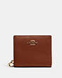 COACH®,SNAP WALLET,Pebbled Leather,Mini,Gold/Redwood,Front View