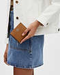 COACH®,SNAP WALLET,Pebbled Leather,Mini,Silver/Light Saddle,Detail View